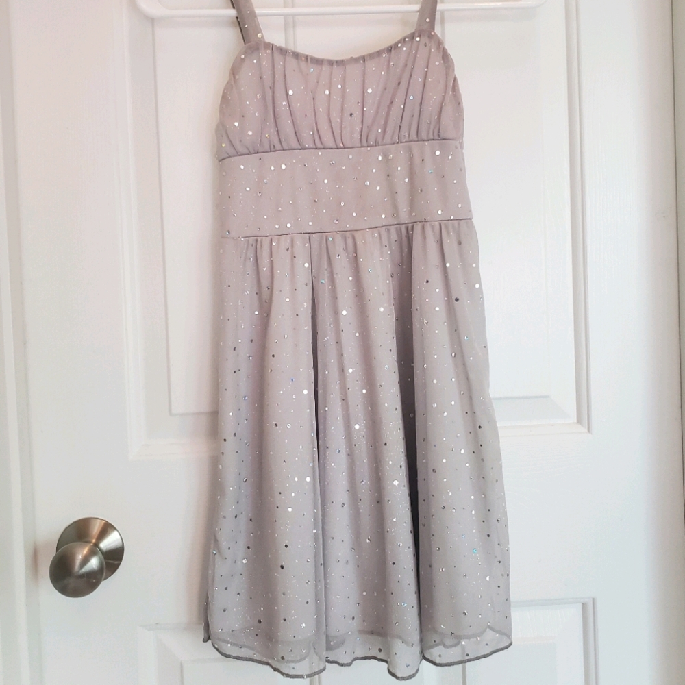 A knee length dress with holographic dots.